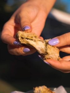 Eggplant bites stuffed with edam cheese slices