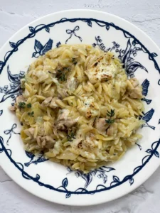 Chicken with caramelized onions, orzo & melted cheese
