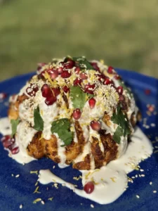 Crispy roasted cauliflower with tahini and pomegranate